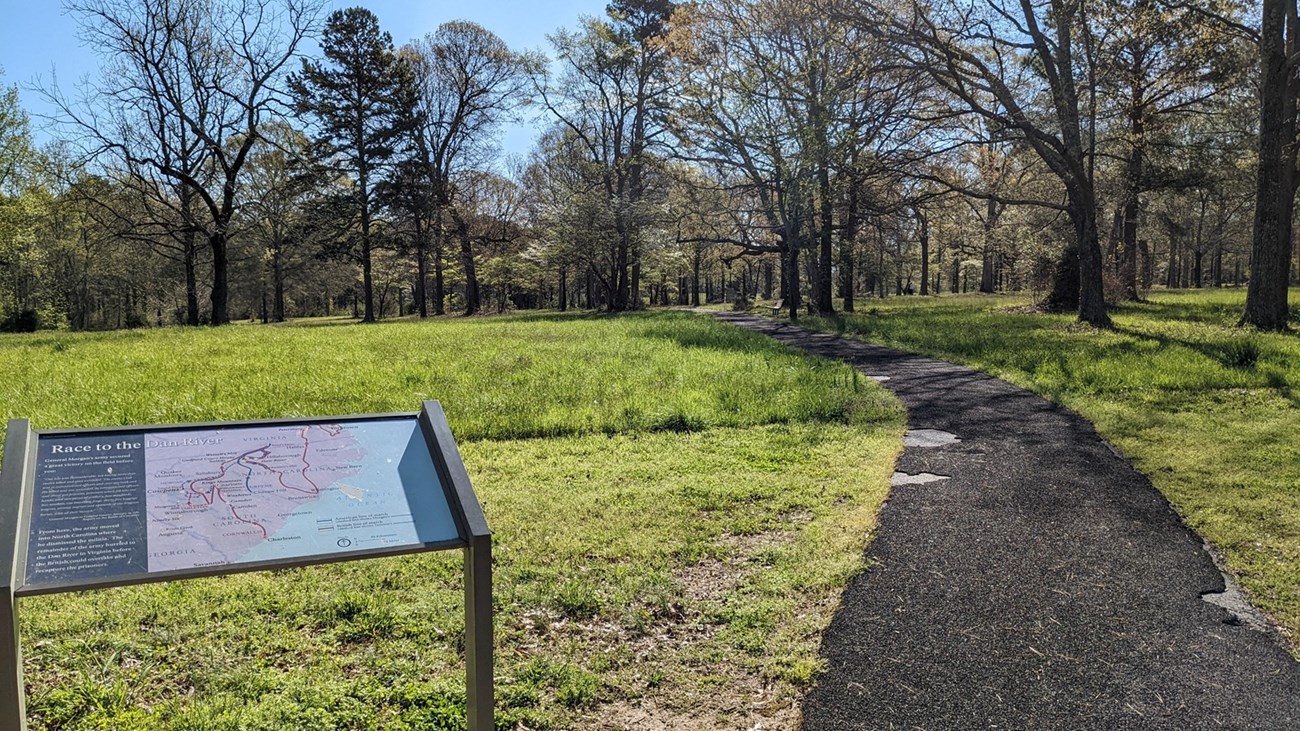 Wayside panel showing small text and a map diagram of the U.S. South with the title “Race to the Dan.”