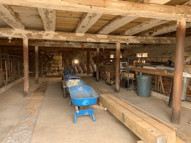 Interior of the basement level of the Roulette Barn with organized tools.