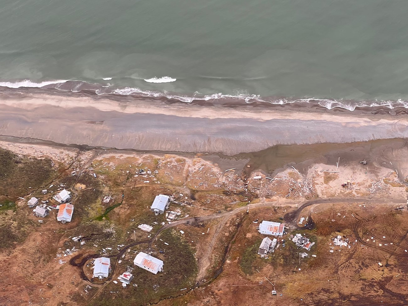Aerial view of coastline storm damage.