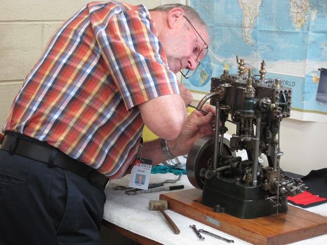 Mose Nowland working in the conservation laboratory at The Henry Ford Museum.