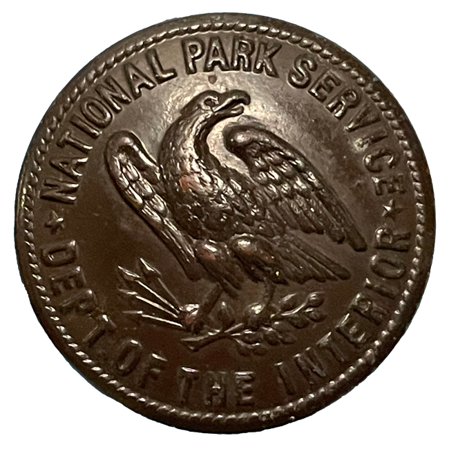 Bronze finished button with eagle face design