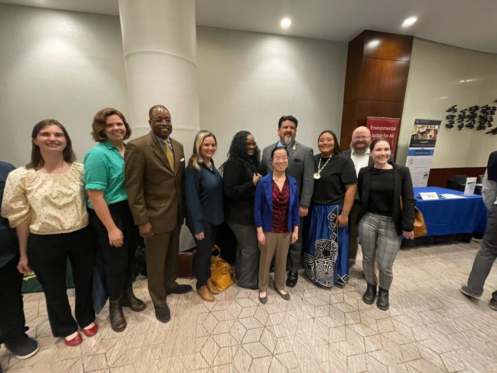 NPS staff with NPS Director at TCN Conference 10 individuals dressed in business clothing with the NPS Director Chuck Sams