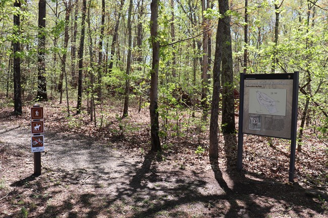 Entrance to trail showing wayside display and trail signs