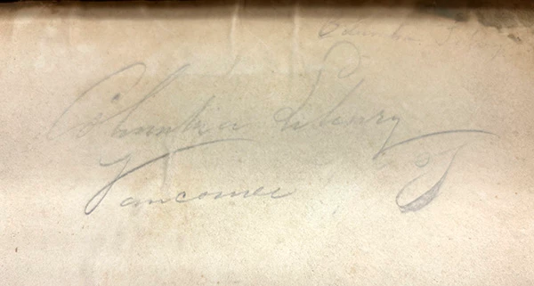 Columbia Library book The page of a book with cursive writing reading "Columbia Library, Vancouver."