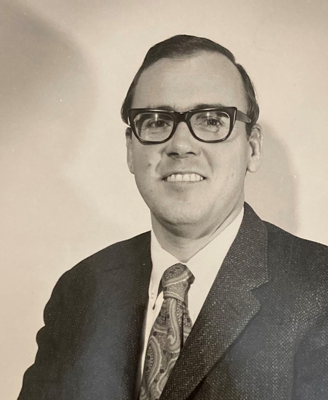 Portrait of James C. Massey in suit and tie