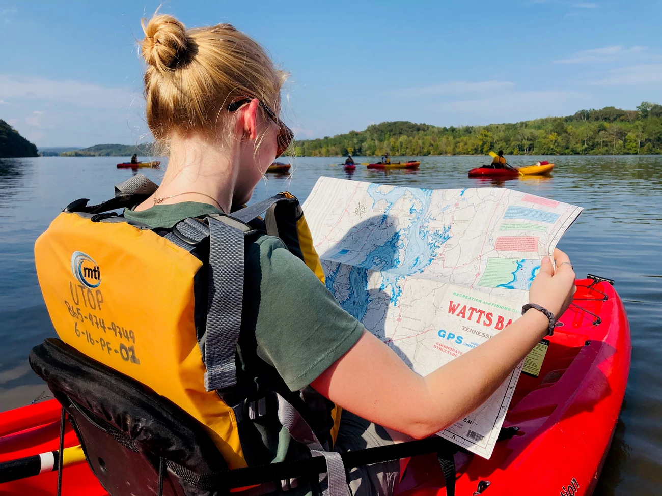 Tennessee River paddler with map Paddler on the Tennessee River holds a map