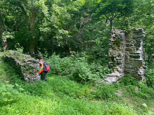 Intern Alexa Olivares and NPS Archaeologist Megan Bailey assess the foundations of a Matildaville structure in Great Falls Park, VA.