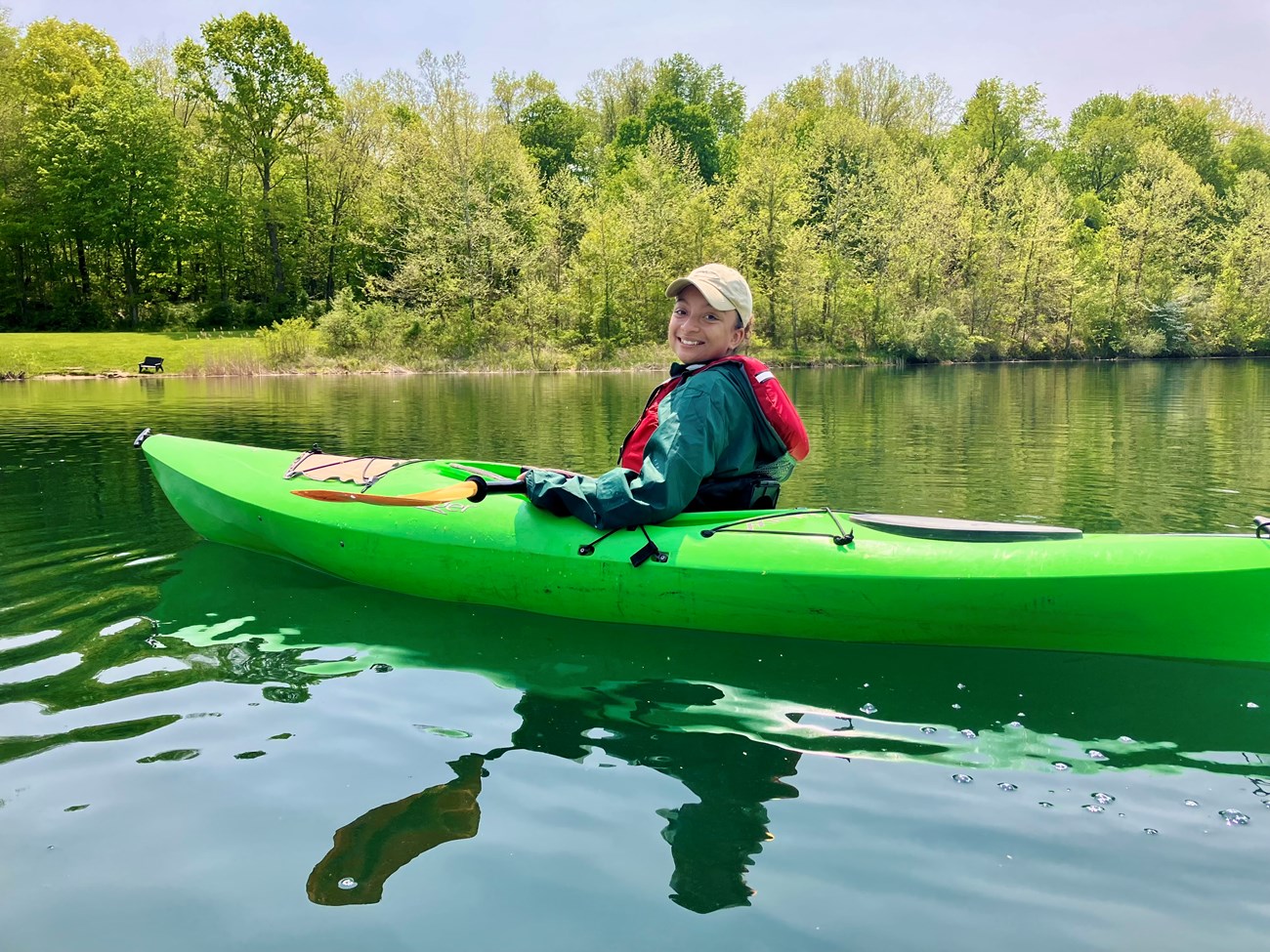 Sylvia Kayaking A woman kayaks on a bright blue day.