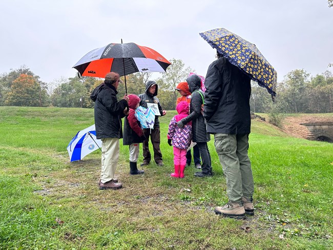 A man talks to a group of people