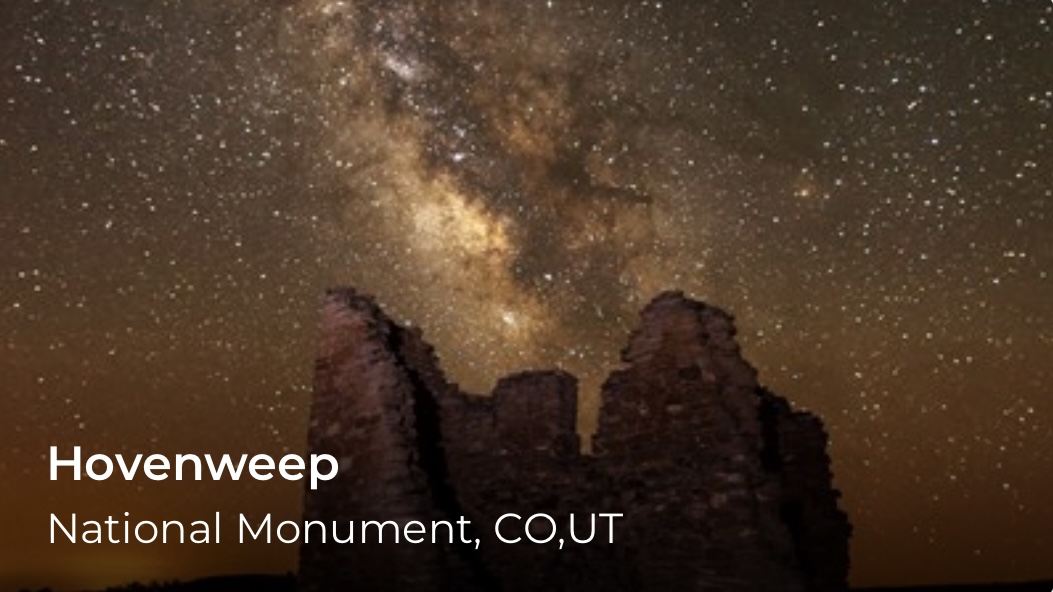 A night sky and milky way over a building with no roof. Words read, Hovenweep.