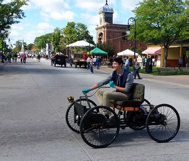 Conservation Technician Andrew Ganem driving the replica quadricycle.