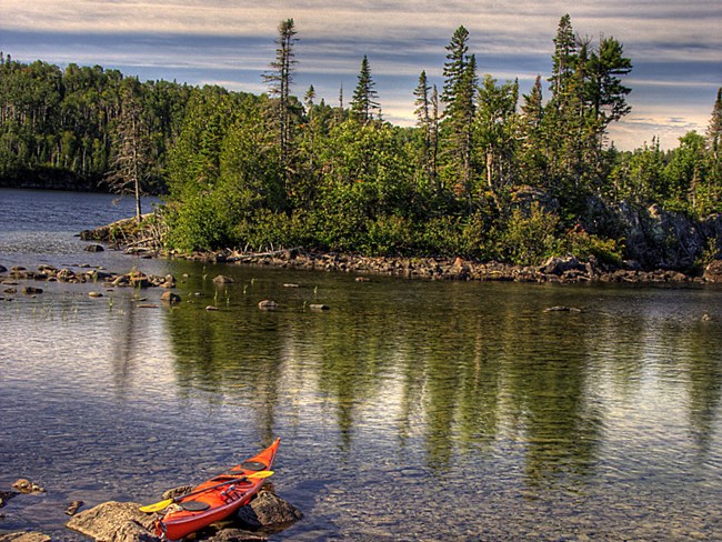 Island Kayak kayak along island shoreline