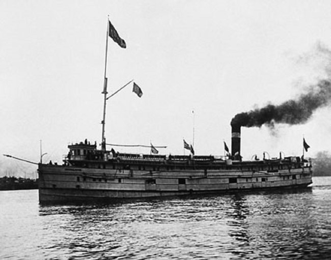 SS Monarch at sea, smoke billowing from its stack