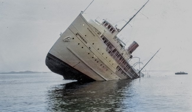 SS George M Cox, stuck on Rock of Ages reef, bow protruding into the air