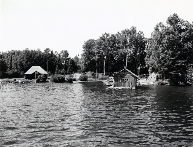 cabin on left and fishhouse on right looking out onto Amygdaloid Channel