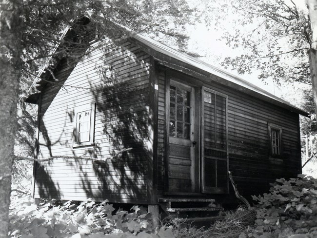 cabin with small windows and just a single corner door