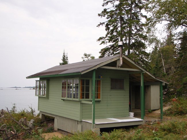 The Farmer Cottage, maintaining its historic integrity and looking out over the Rock Harbor channel in 2012.