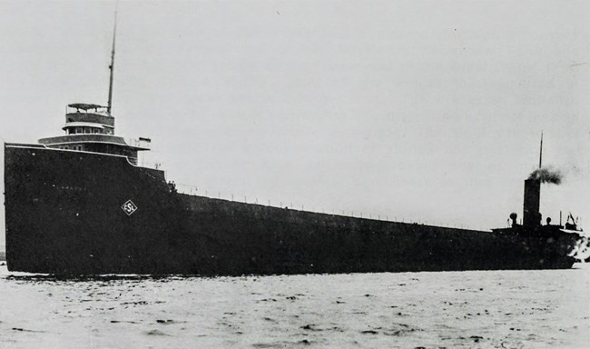 early, port side view of SS Emperor with dark paint scheme throughout