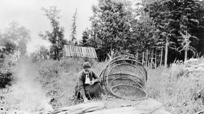 Malone Fishery girl holding a large fishing net