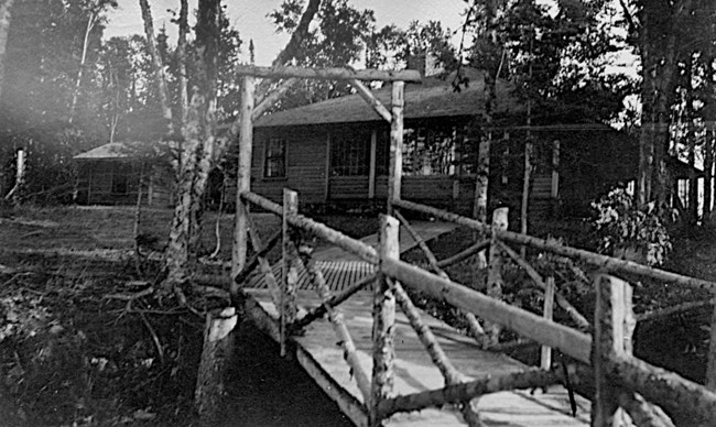 elaborate camp with many wood boardwalks, big boathouses, and large cabins