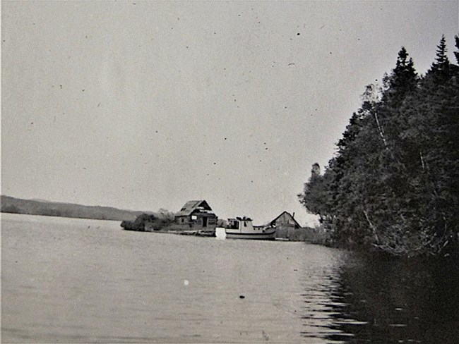 fishhouse and dock at the edge of Little Todd Harbor,