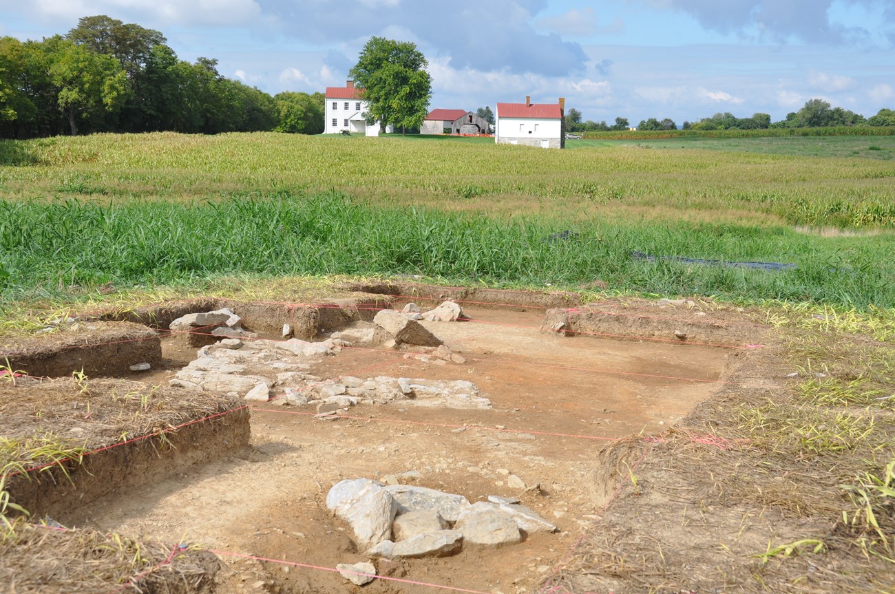 Excavation with farm buildings