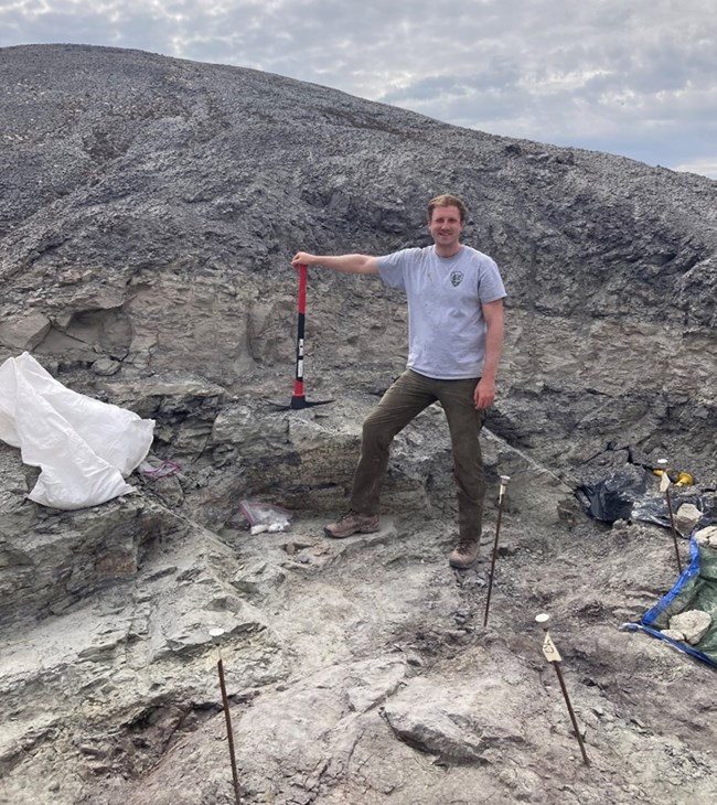 A ;person standing on a rock outcrop