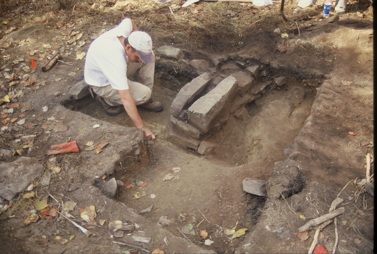 Archeologist in a square dirt unit