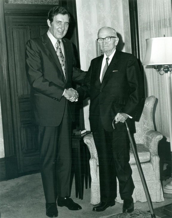 Senator Edmund S. Muskie and Harry S Truman in the living room of the Truman home, December 14, 1970. (Harry S Truman Library photo 71-920) Senator Edmund Muskie shaking hands with Harry S Truman. Both men standing.