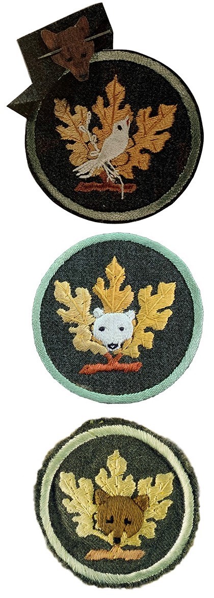 Three round naturalist patches: white bird, white bear, brown bear