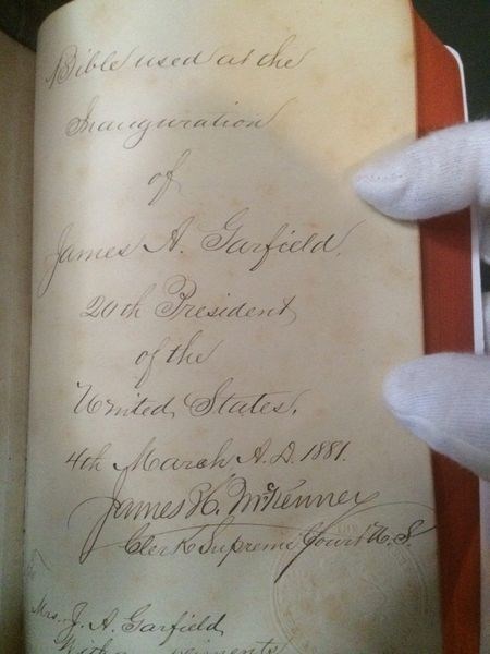 Front page of handwritten Bible used at the Inauguration of James A. Garfield 20th President of the United States, NPS photo James Garfield National Historic Site A handwritten Bible used in the inauguration of President James A. Garfield is held open to the first page by a person wearing a white glove