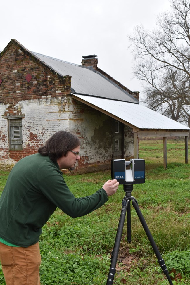 Jason Church setting up laser scanner at Magnolia Plantation. Jason Church setting up laser scanner at Magnolia Plantation.