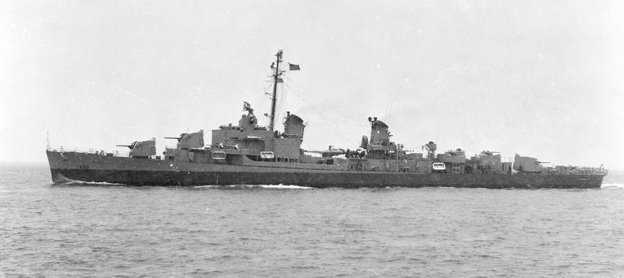 A black and white photo of the USS Joseph P. Kennedy Jr. at sea.