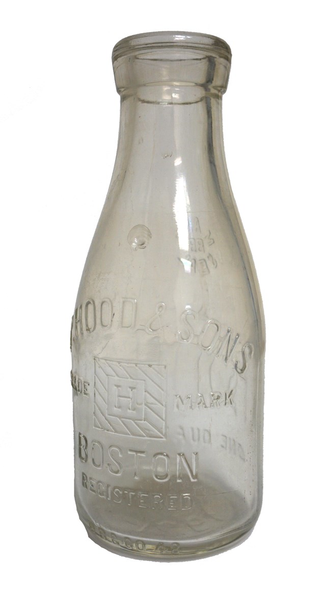 An old-fashioned glass milk bottle
