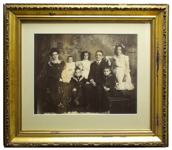 A gold-framed black and white photo of the Fitzgerald Family