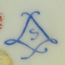 lt= Blue mark on white ceramic of S enclosed in two cursive Ls