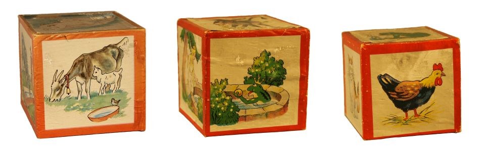 lt= Three blocks with red edges and illustrations including goats, a princess and frog in pool, cat, and chicken
