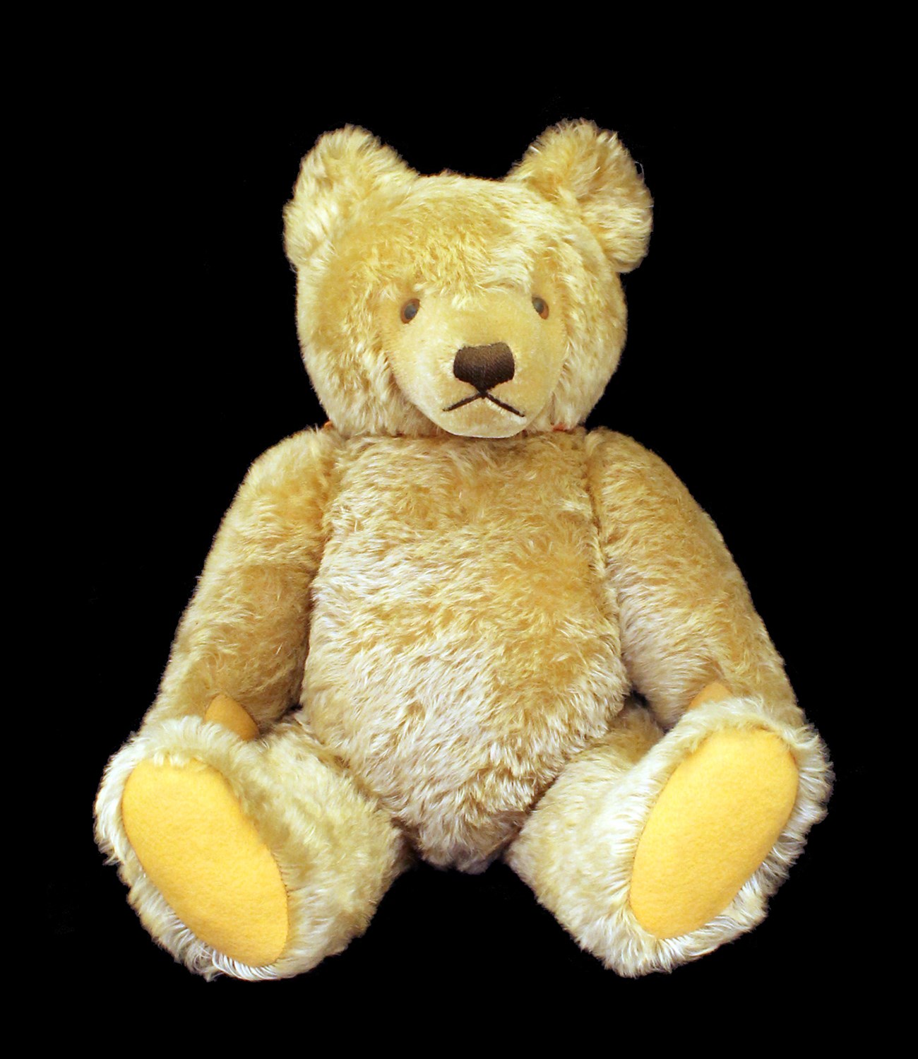 Light brown jointed teddy bear