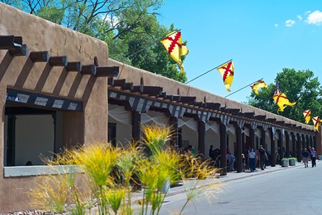 One of the oldest, best-preserved buildings central to El Camino Real history is the 1610 adobe Palace of the Governors on the plaza in Santa Fe.  Photo © Jack Parsons.