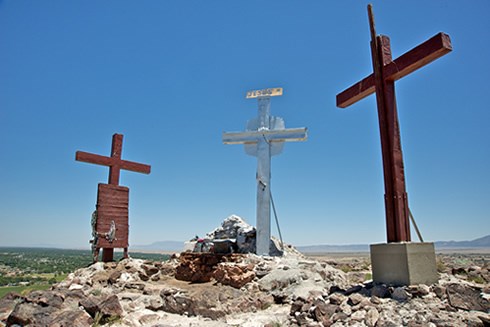 The cross-studded summit of El Cerro de Tomé reflects the spiritual meaning of the journey to the top for many pilgrims. Photo © Jack Parsons The cross-studded summit of El Cerro de Tomé reflects the spiritual meaning of the journey to the top for many pilgrims. Photo © Jack Parsons