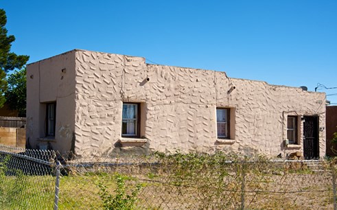 After picking numbers from a hat to secure their home sites, the first settlers in the Mesquite Historic District built small, low-slung adobe homes, such as this one, with simple floor plans and flat roofs. Photo © Jack Parsons
