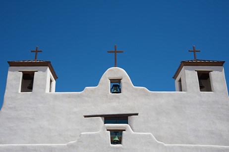 El Camino Real passes by St. Augustine Church at Isleta Pueblo, south of Albuquerque, New Mexico. The church has recently been restored. Photo © Jack Parsons.