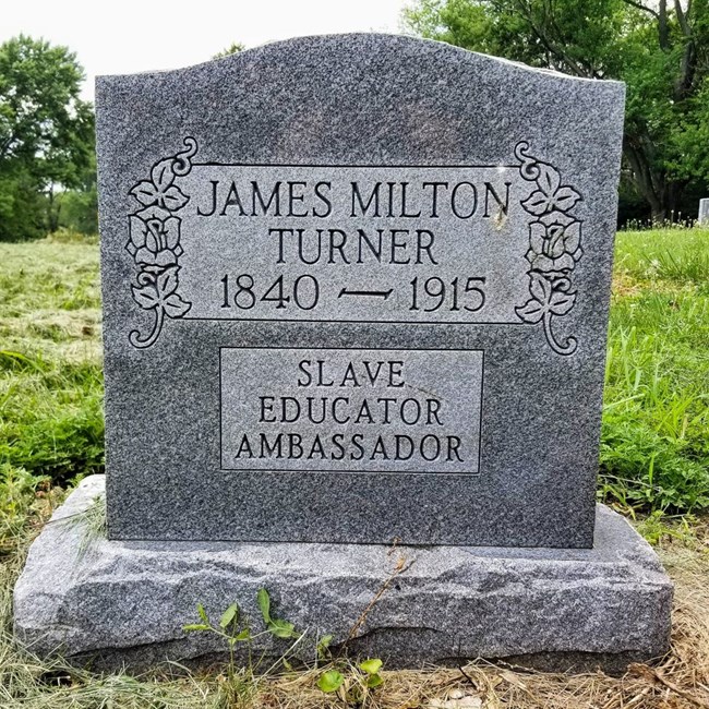 Granite Headstone that reads "James Milton Turner 1840-1915 Slave Educator Ambassador"