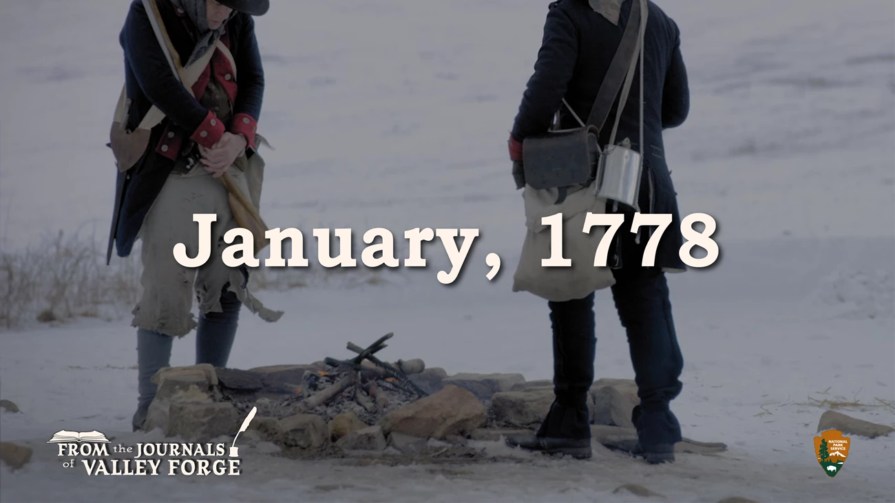 January 1778 From The Journals of Valley Forge Two soldiers in ragged uniforms stand close to a campfire in a snowy field. Text superimposed over the image reads “From the Journals of Valley Forge, January 1778."