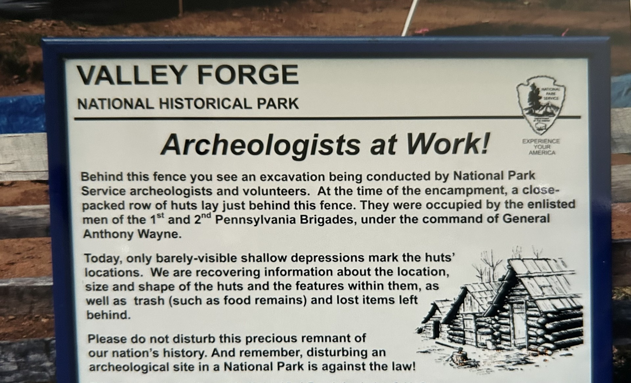 A information sign describing the archeologist working in a closed off area.
