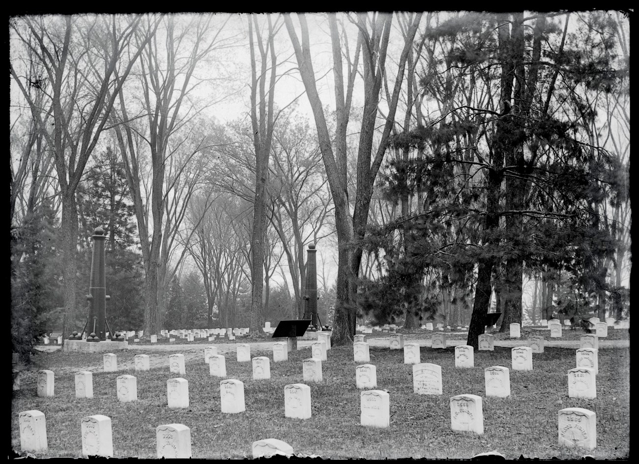 Jefferson Barracks National Cemetery circa 1890s - MOHIST Black and white photo a cemetery with white headstones.