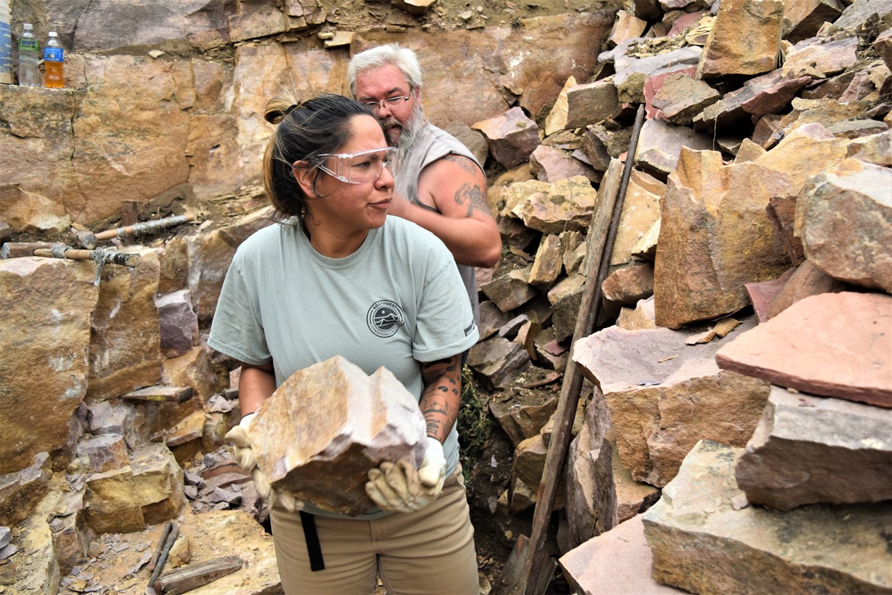 Jessica Arkeketa working with stones