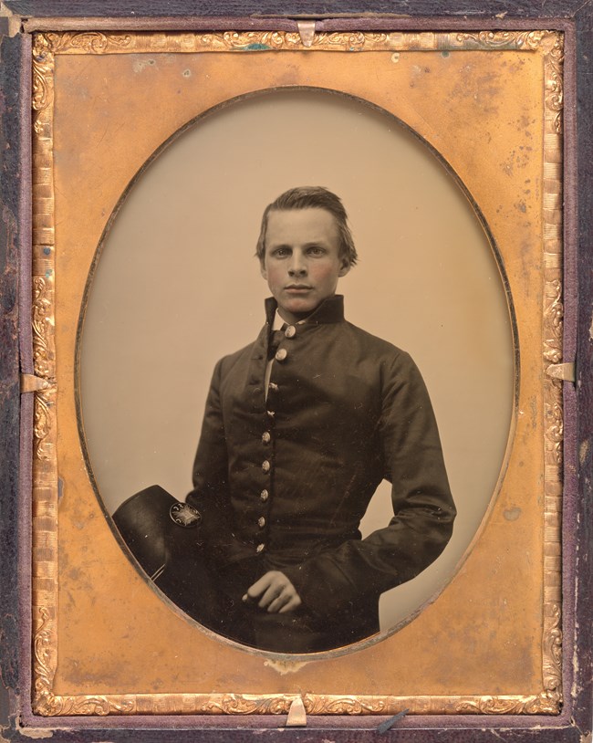 A young, white, male Confederate military officer in dress uniform