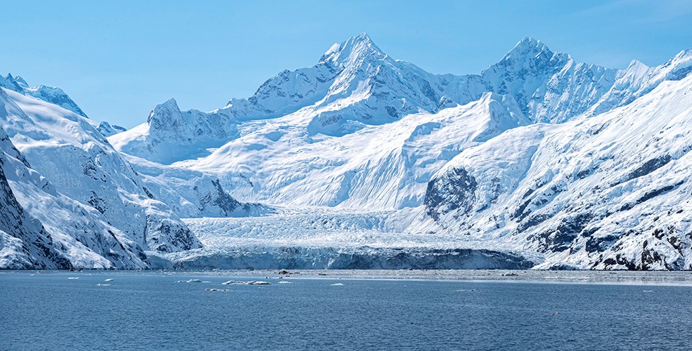 JohnsHopkinsGlacier_NPSSeanTevebaugh_web A tidewater glacier meets the sea from the mountains.