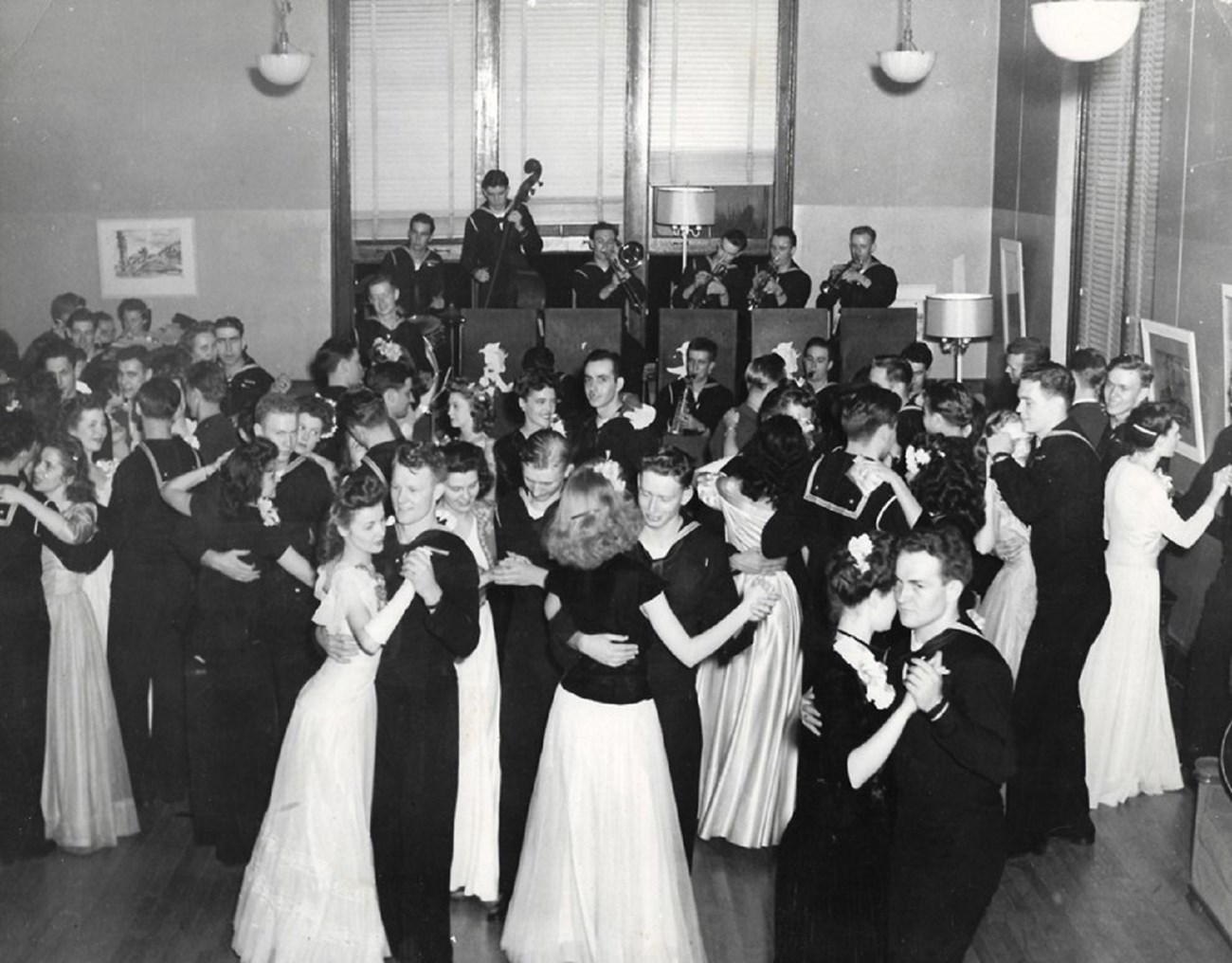 V-12 Dance during WWII black and white photo of men and women dancing at a formal dance